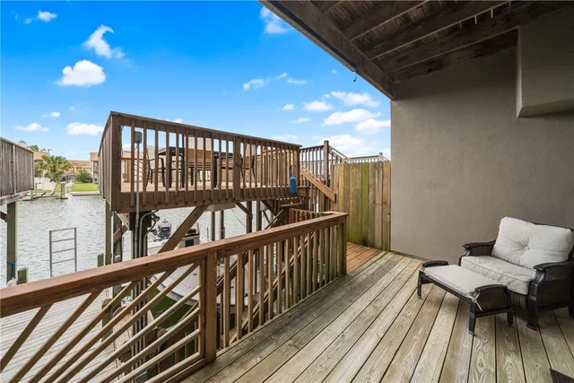 a view of a balcony with wooden floor and outdoor space