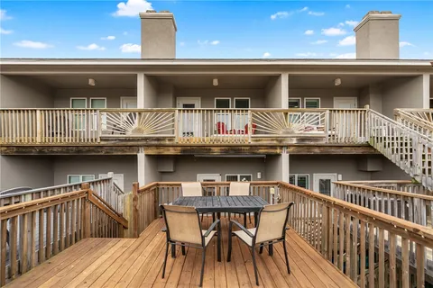 an aerial view of a residential building with outdoor space