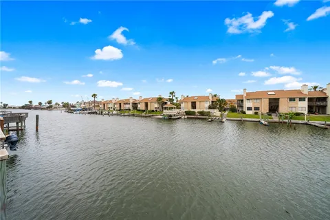 an aerial view of a house with swimming pool patio and outdoor seating