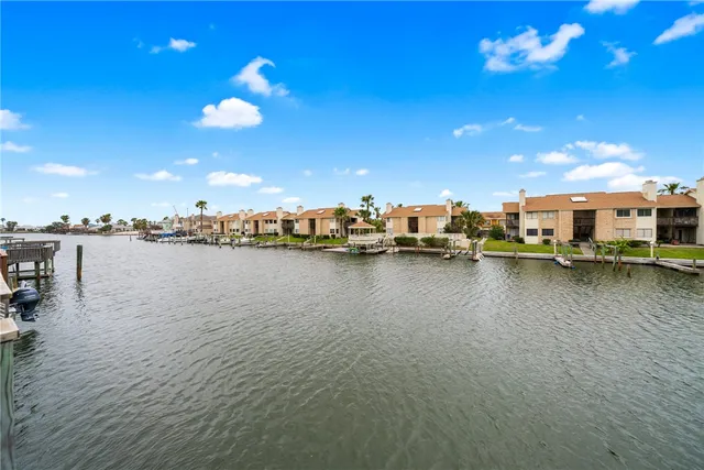 an aerial view of a house with swimming pool patio and outdoor seating