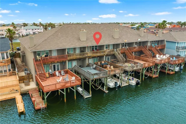 an aerial view of a city with an ocean view