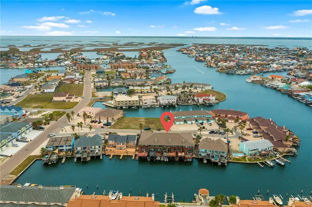 an aerial view of a city with a lake view