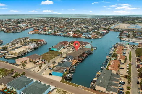an aerial view of a house with a lake view