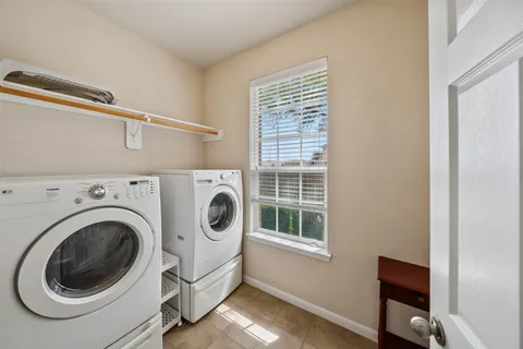 a kitchen with a sink stove top oven and refrigerator