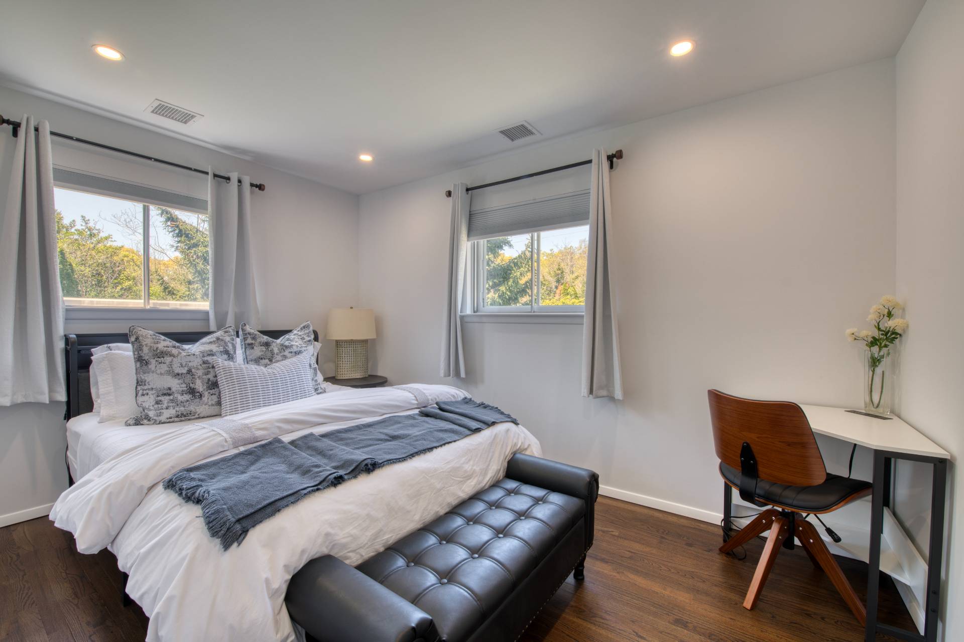 88 Old Country Road East Quogue, NY 11942 - Photo 7 of 10 a bedroom with a bed and a table