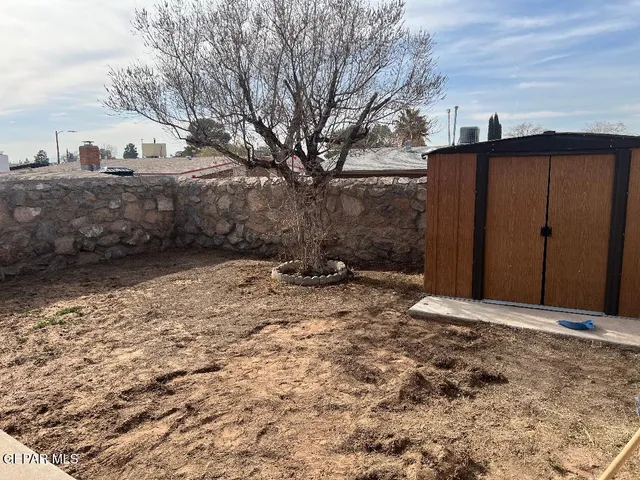 a view of a backyard of the house
