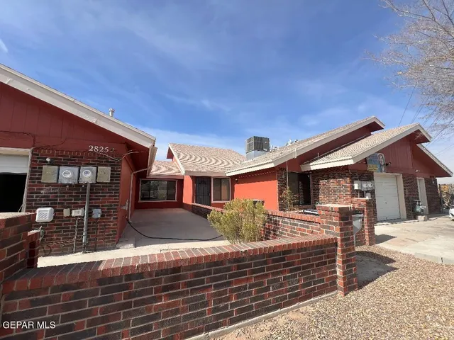 a front view of a house with yard