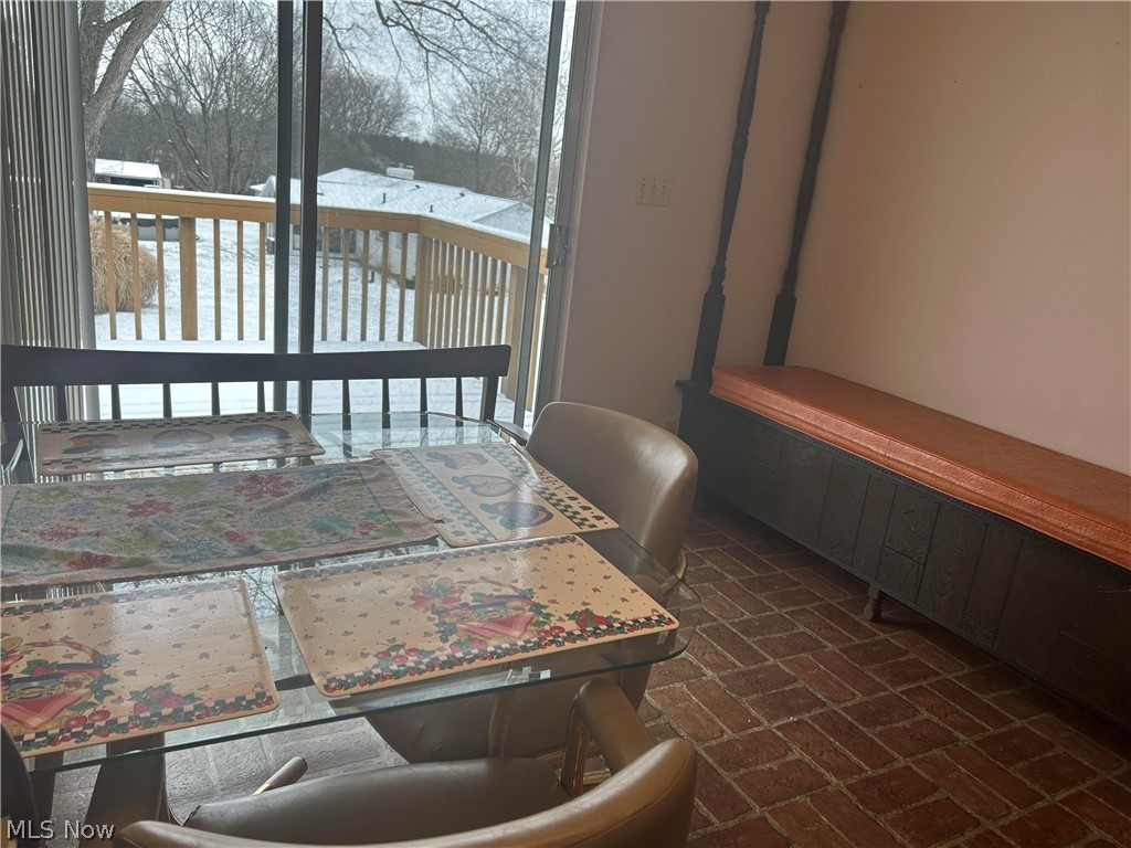 115 Lester Road New Franklin, OH 44319 - Photo 8 of 15 dining room with sliding glass door leading to deck
