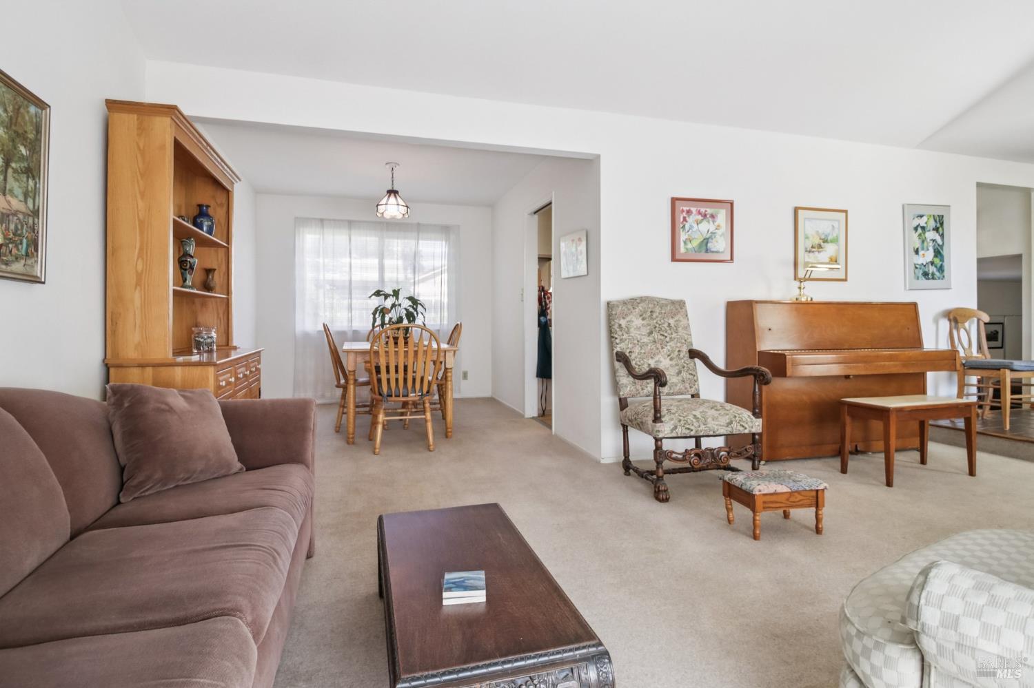 3217 Ensenada Drive San Ramon, CA 94583 - Photo 14 of 64 a living room with furniture and a chandelier