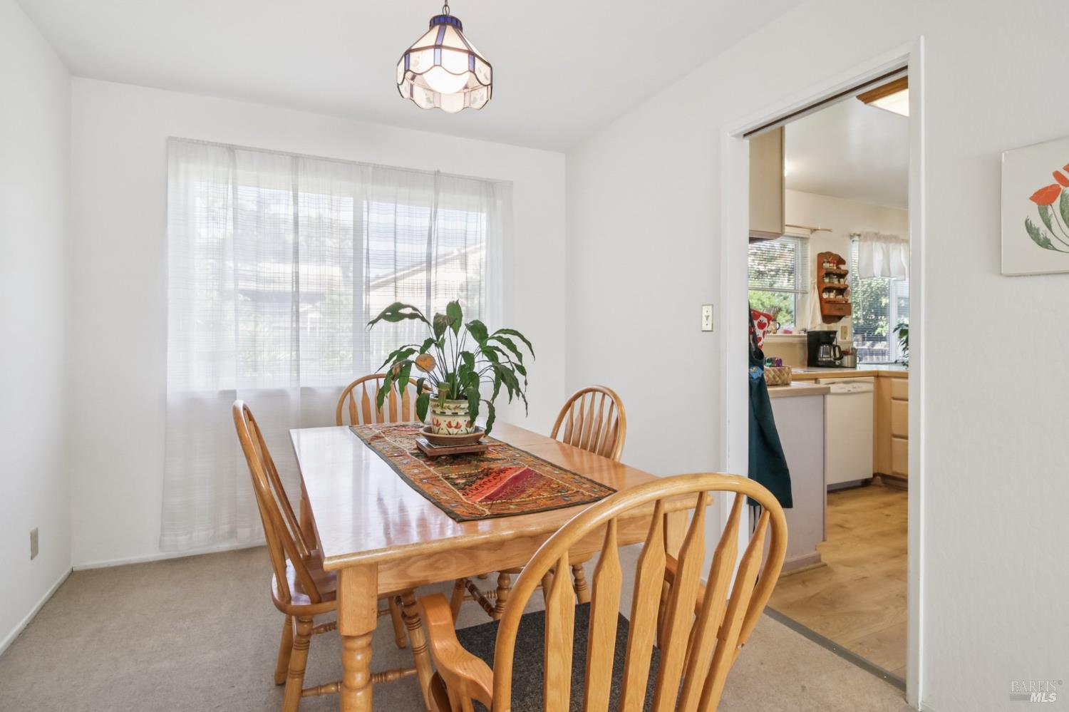 3217 Ensenada Drive San Ramon, CA 94583 - Photo 22 of 64 a dining room with furniture potted plants and wooden floor