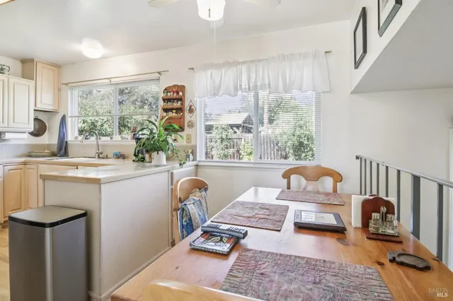 a bedroom with a bed and dresser with mirror