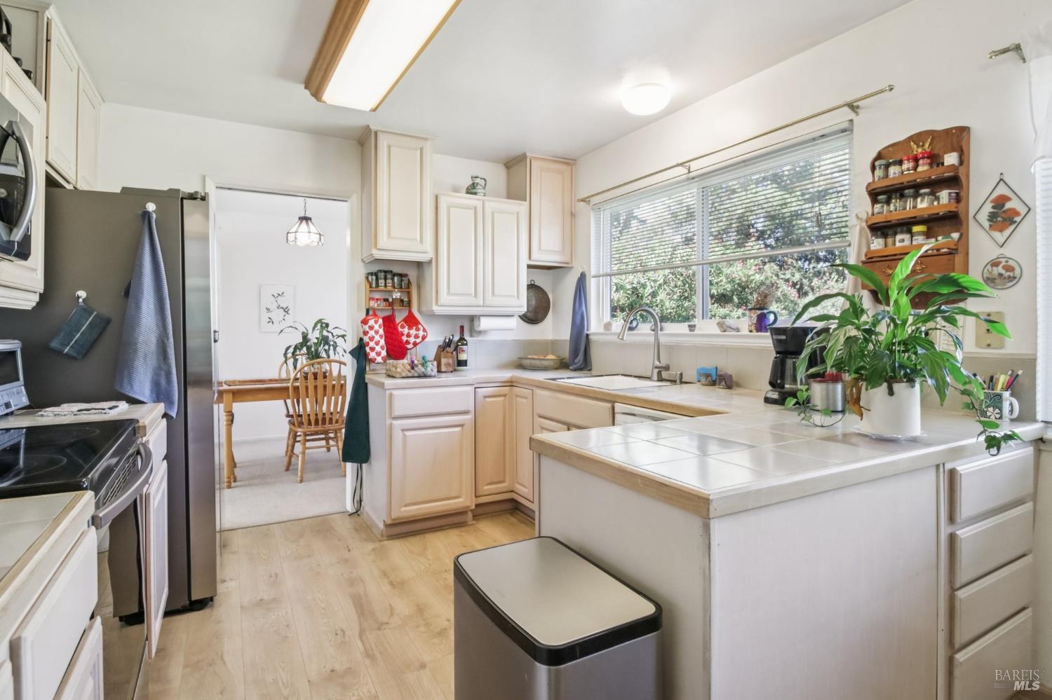 3217 Ensenada Drive San Ramon, CA 94583 - Photo 31 of 64 a kitchen with a sink stove and refrigerator