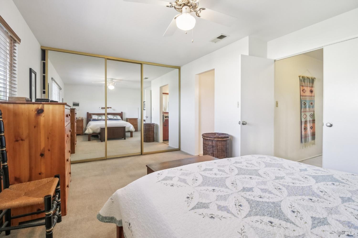 3217 Ensenada Drive San Ramon, CA 94583 - Photo 36 of 64 a bedroom with a bed and dresser with mirror