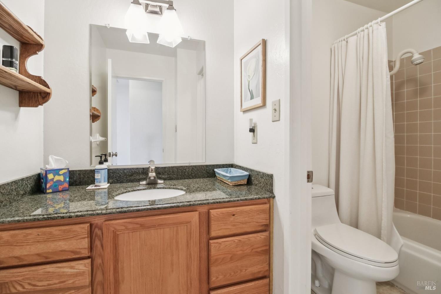 3217 Ensenada Drive San Ramon, CA 94583 - Photo 39 of 64 a bathroom with a granite countertop sink and a mirror
