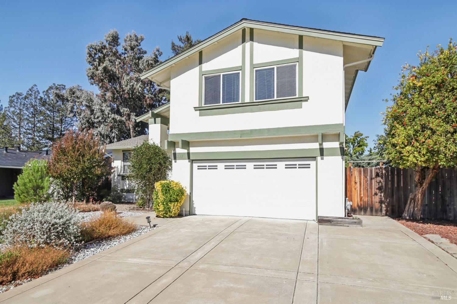 3217 Ensenada Drive San Ramon, CA 94583 - Photo 4 of 64 a front view of a house with a yard and garage