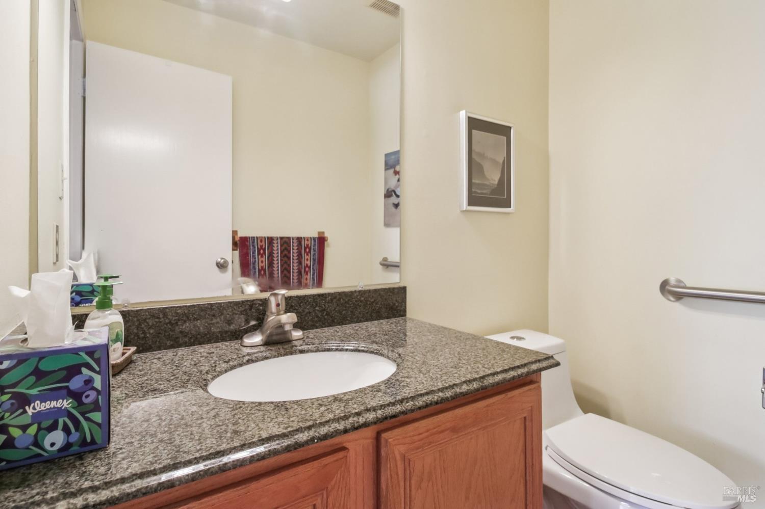 3217 Ensenada Drive San Ramon, CA 94583 - Photo 47 of 64 a bathroom with a granite countertop sink and a mirror