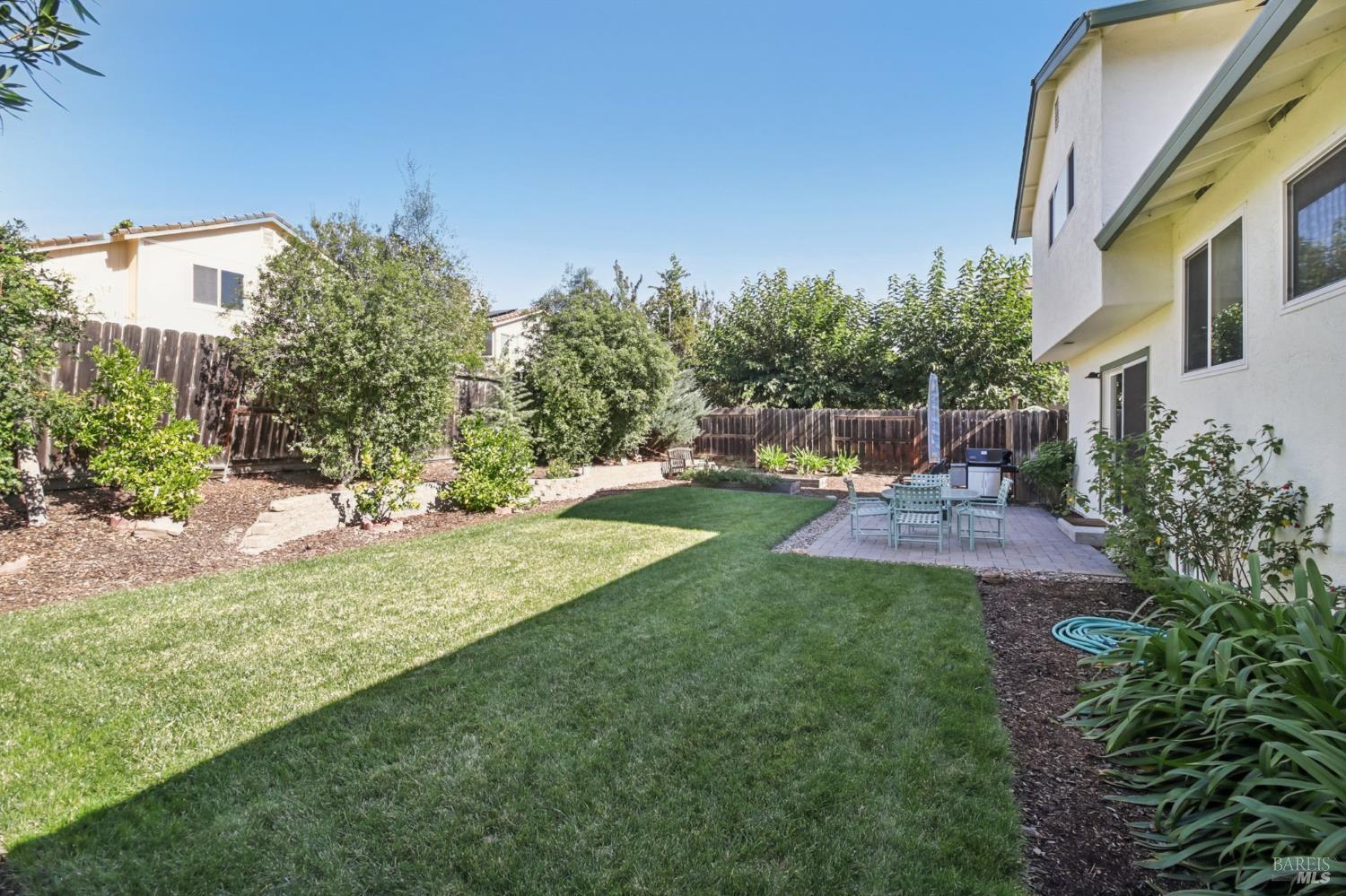 3217 Ensenada Drive San Ramon, CA 94583 - Photo 50 of 64 a view of a patio with a table and chairs with wooden fence