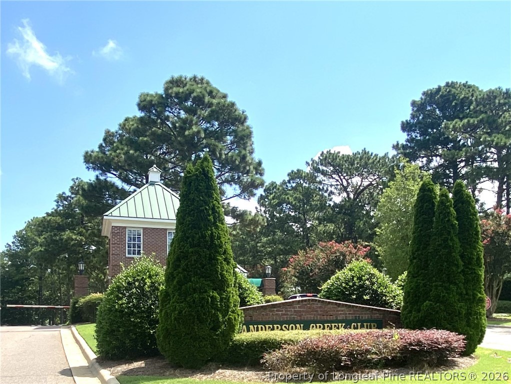 175 Pine Hawk Drive Spring Lake, NC 28390 - Photo 43 of 43 a front view of a house with a yard and potted plants