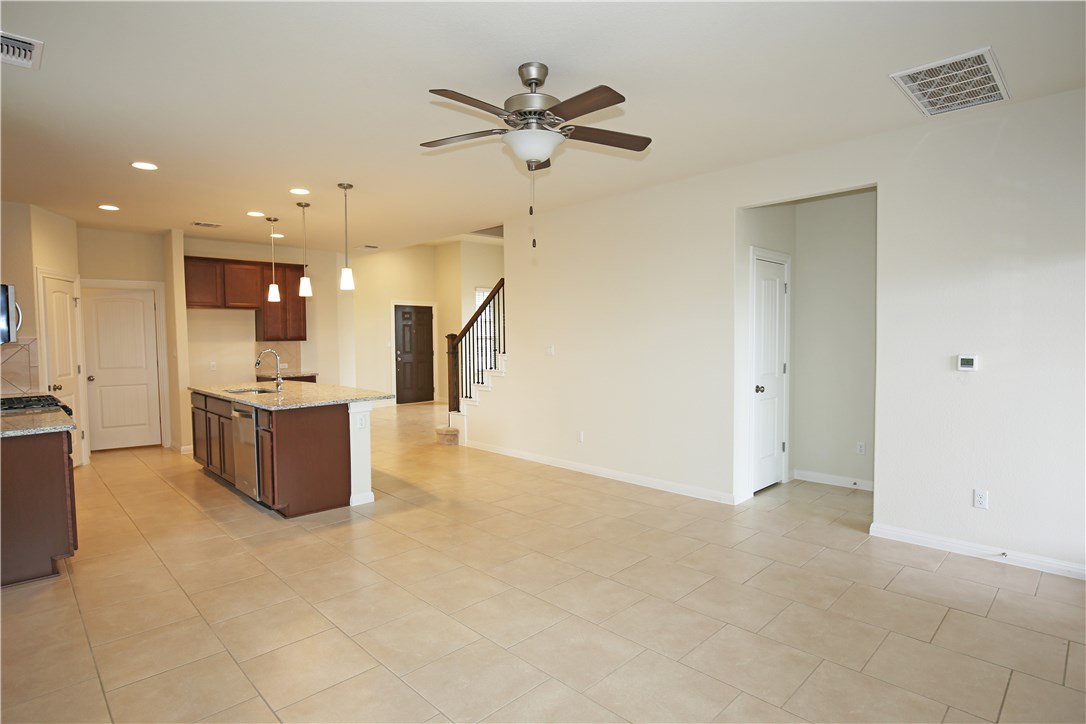 15912 Cessida Street Austin, TX 78728 - Photo 7 of 23 a view of kitchen with refrigerator and window