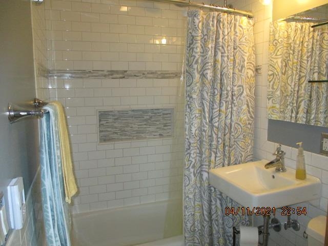3918 Pinecrest Road Rockford, IL 61107 - Photo 12 of 21 a bathroom with a sink shower and a mirror