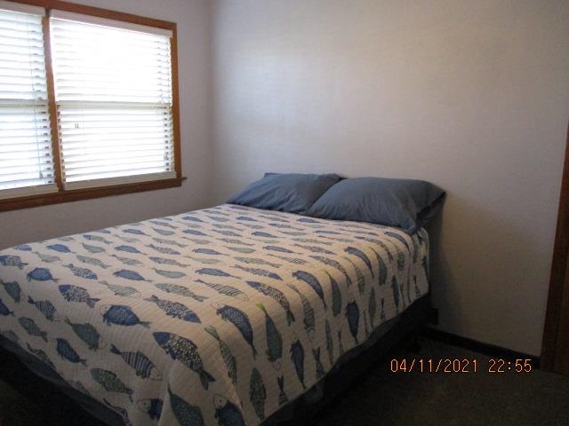 3918 Pinecrest Road Rockford, IL 61107 - Photo 16 of 21 a bed sitting in a bedroom next to a window