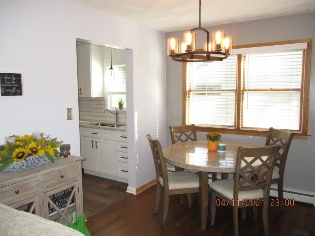 3918 Pinecrest Road Rockford, IL 61107 - Photo 3 of 21 a view of a dining room with furniture and chandelier