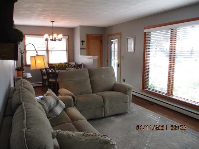 3918 Pinecrest Road Rockford, IL 61107 - Photo 6 of 21 a living room with furniture and a chandelier