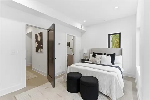 a bedroom with bed and walk in closet