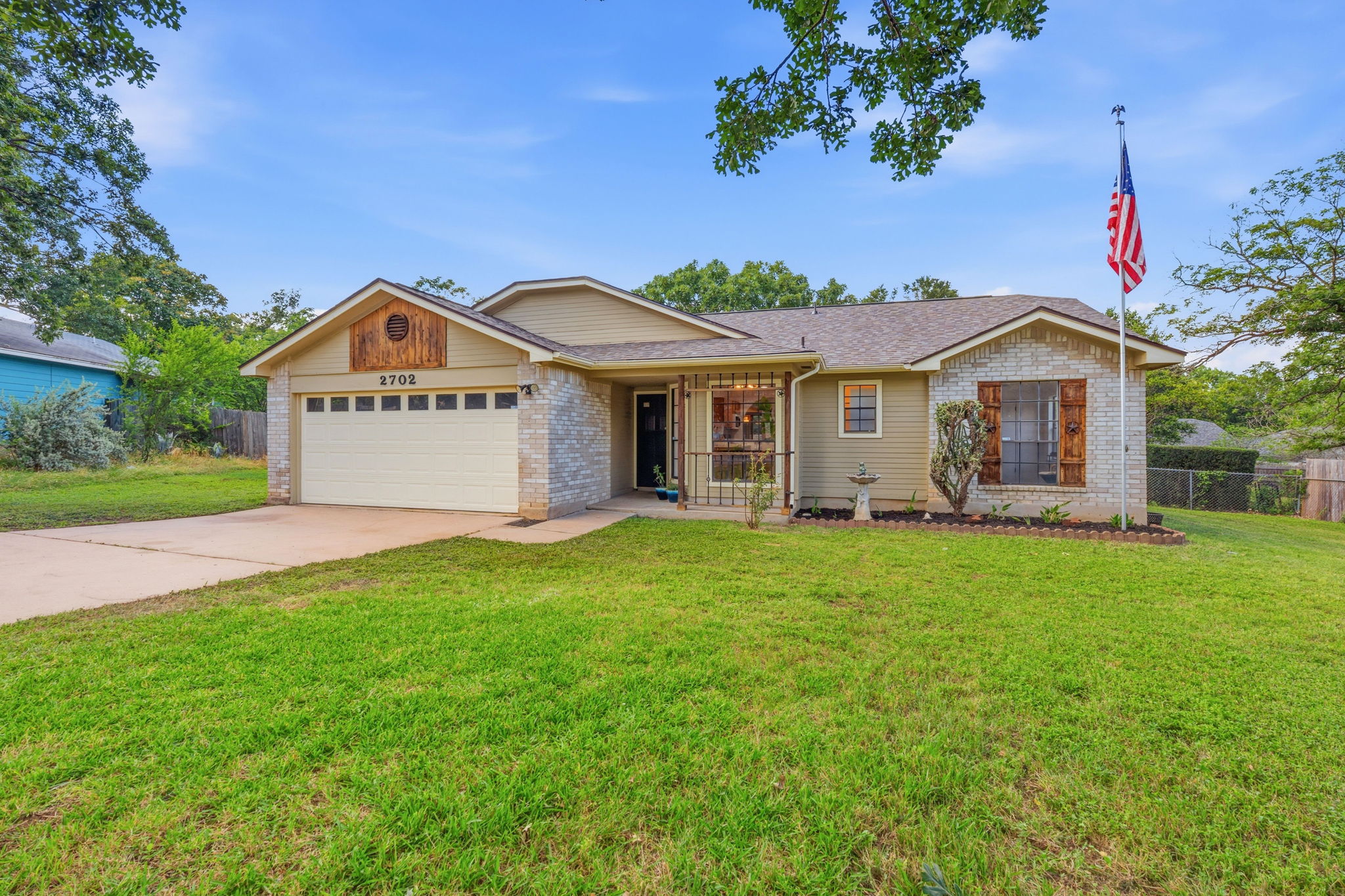 2702 Calabash Cove Austin, TX 78745 - Photo 2 of 40 a front view of a house with a garden