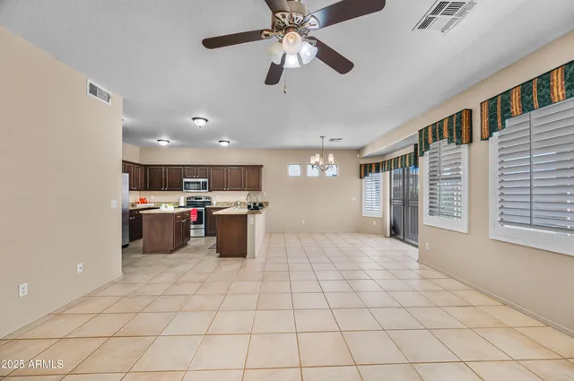 an aerial view of residential houses with yard