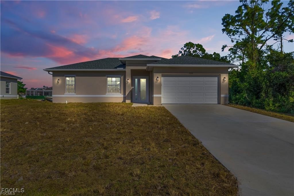 a view of a house with a yard