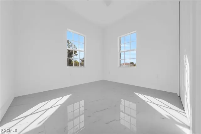 an empty room with windows