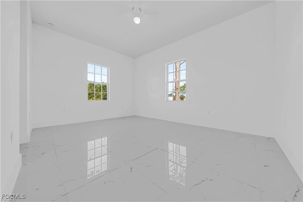 3310 11th Street West Lehigh Acres, FL 33971 - Photo 13 of 20 an empty room with windows