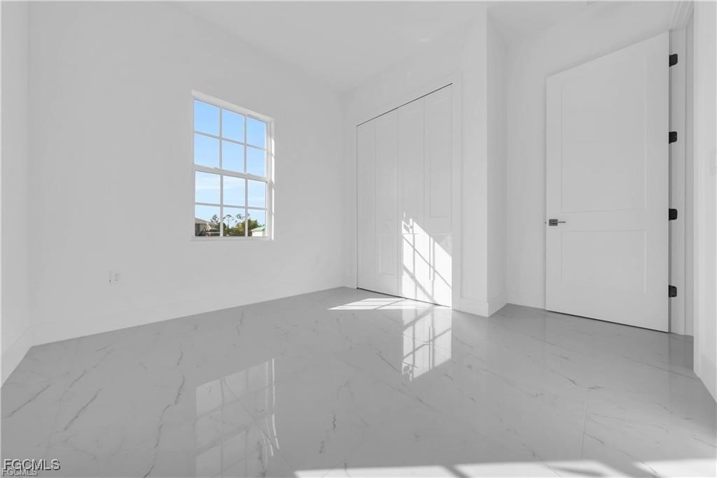 3310 11th Street West Lehigh Acres, FL 33971 - Photo 15 of 20 a view of empty room with window