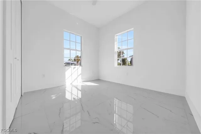 a view of empty room with windows