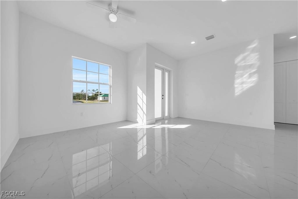 3310 11th Street West Lehigh Acres, FL 33971 - Photo 3 of 20 an empty room with windows