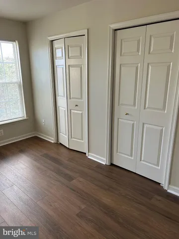 a kitchen with a sink and large window