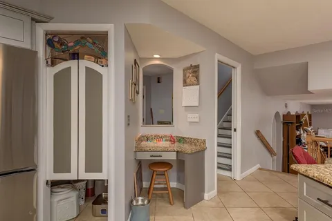 a bathroom with a sink vanity mirror and toilet