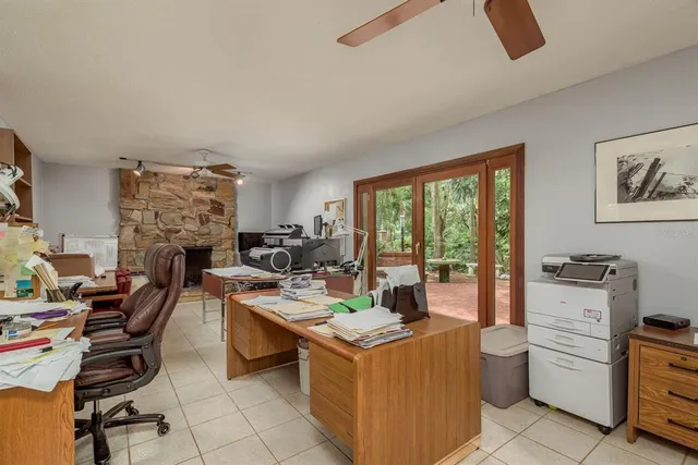 a view of a hallway with a livingroom and closet