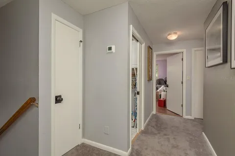 a bedroom with a bed and a chair