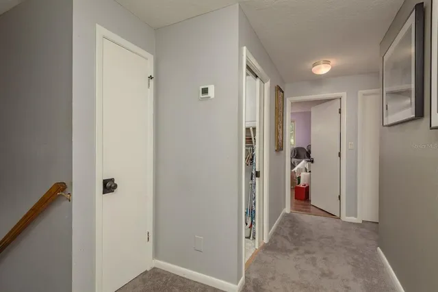 a bedroom with a bed and a chair