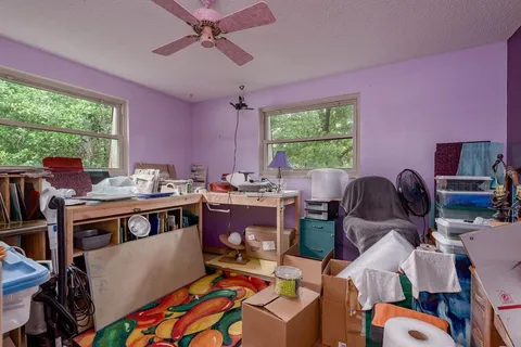 a backyard of a house with table and chairs