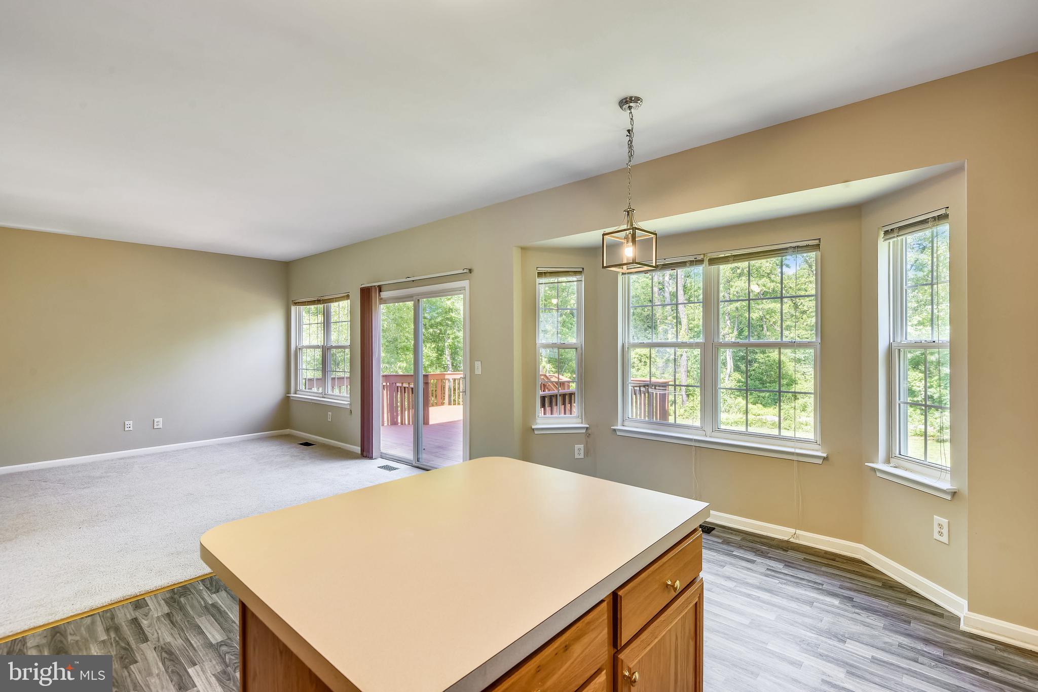 8174 WB&A Road Severn, MD 21144 - Photo 13 of 36 Kitchen island looks toward the great room