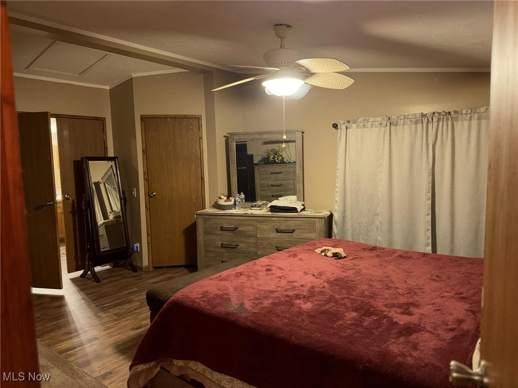 56 3rd Street Rayland, OH 43943 - Photo 33 of 46 Bedroom featuring a closet, a ceiling fan, dark wood finished floors, and lofted ceiling