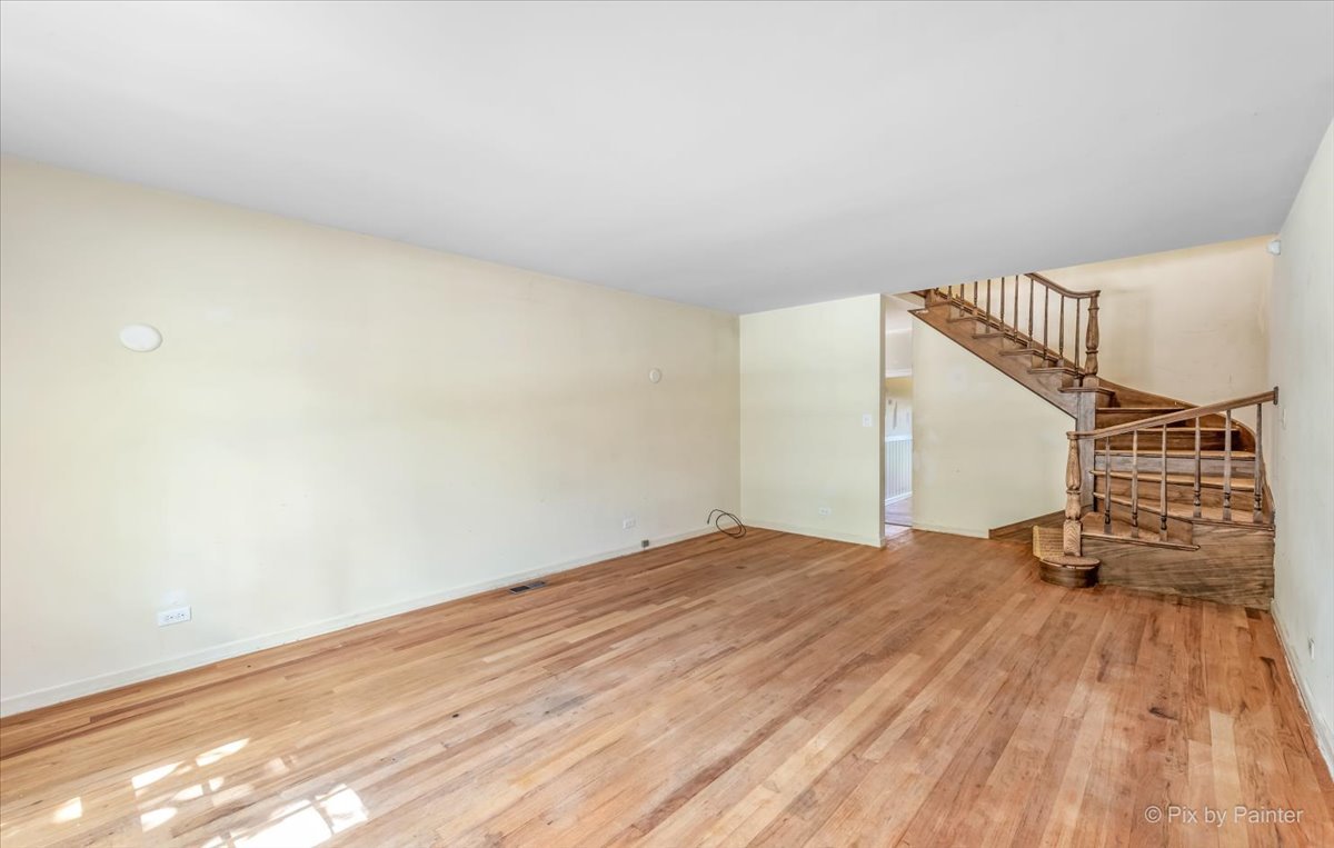 8 Woodbine Road Rolling Meadows, IL 60008 - Photo 14 of 44 a view of a room with wooden floor and white walls