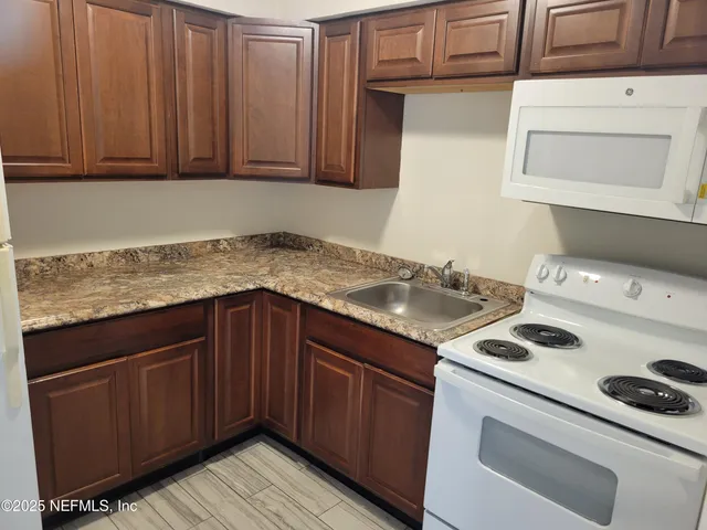 a kitchen with a cabinets and stove