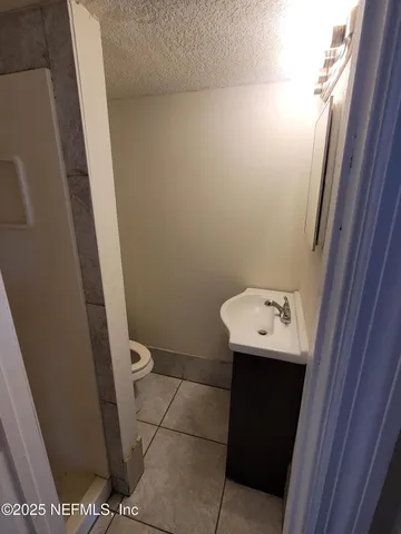 a bathroom with a sink and toilet