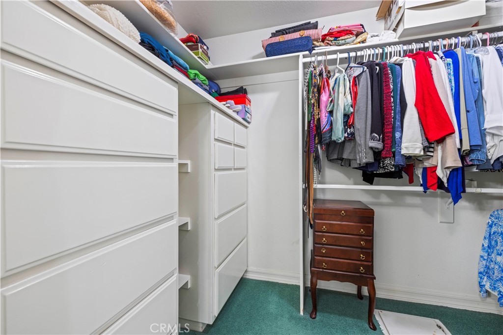 25707 Pacy Street Newhall, CA 91321 - Photo 41 of 62 primary bedroom walk-in closet & floor laundry chute