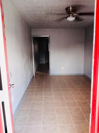 a view of an empty room with a white door