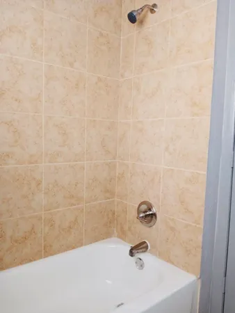 a bathroom with a white bath tub